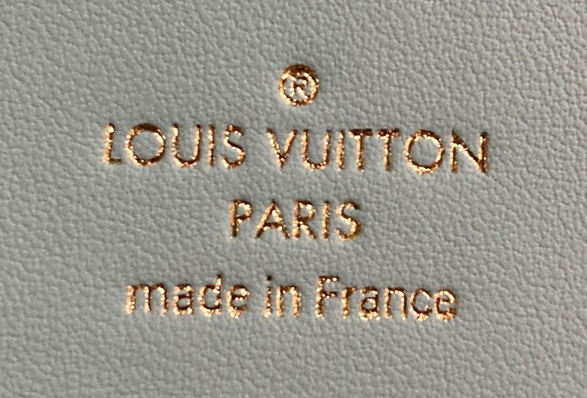 Capucines Vertical Wallet Leather