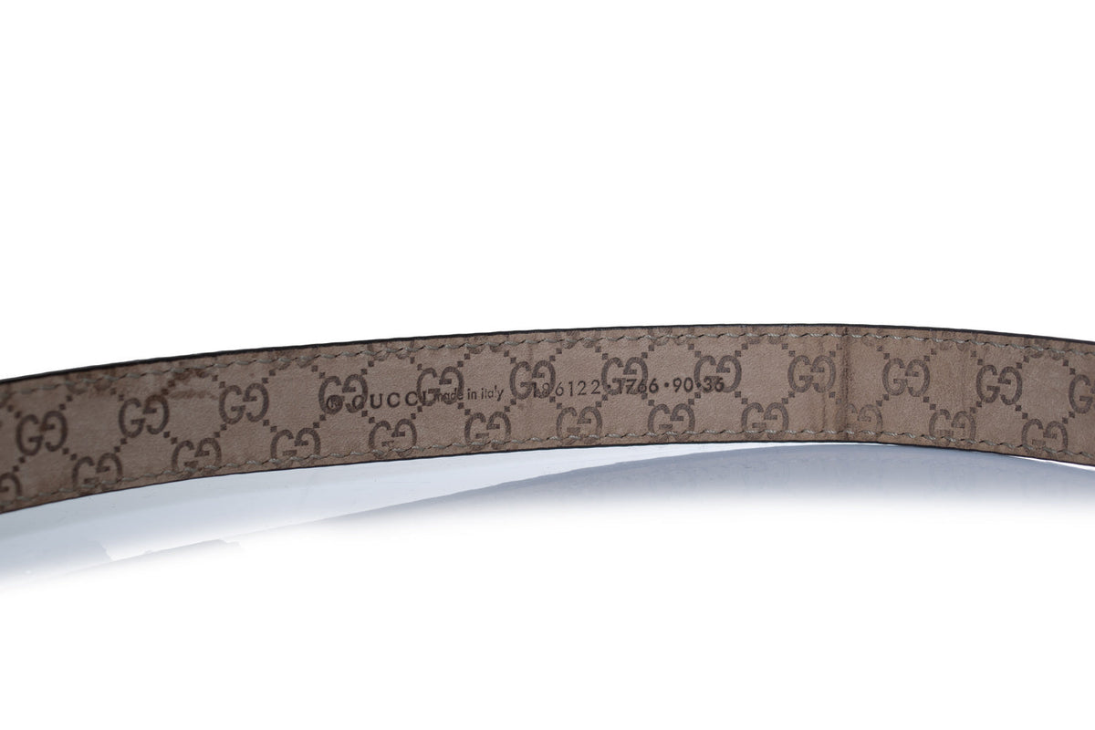 Gucci, python leather belt with gold metal bow