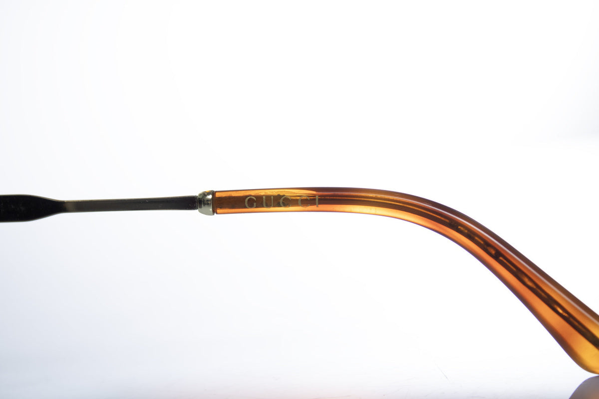 Gucci, transparent and gold aviator