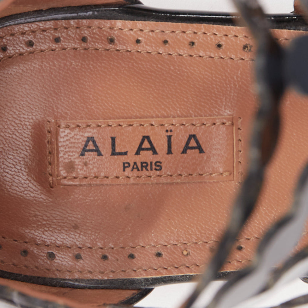 Women's Alaia Patent Scalloped Cage Sandals