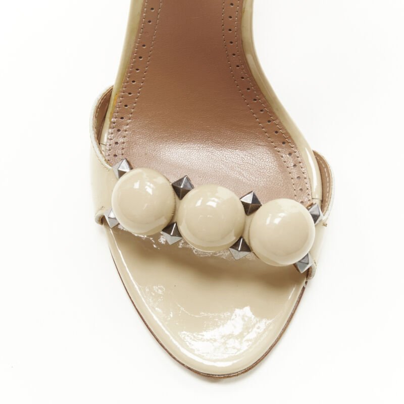 Women's Alaia La Bombe ball embellished studded patent sandal