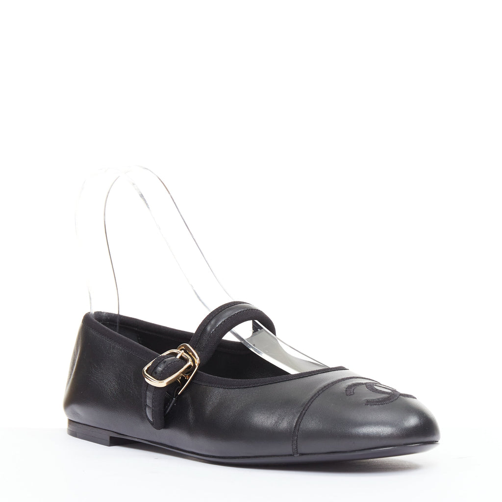Women's Chanel black soft lambskin stitched CC cap toe flats