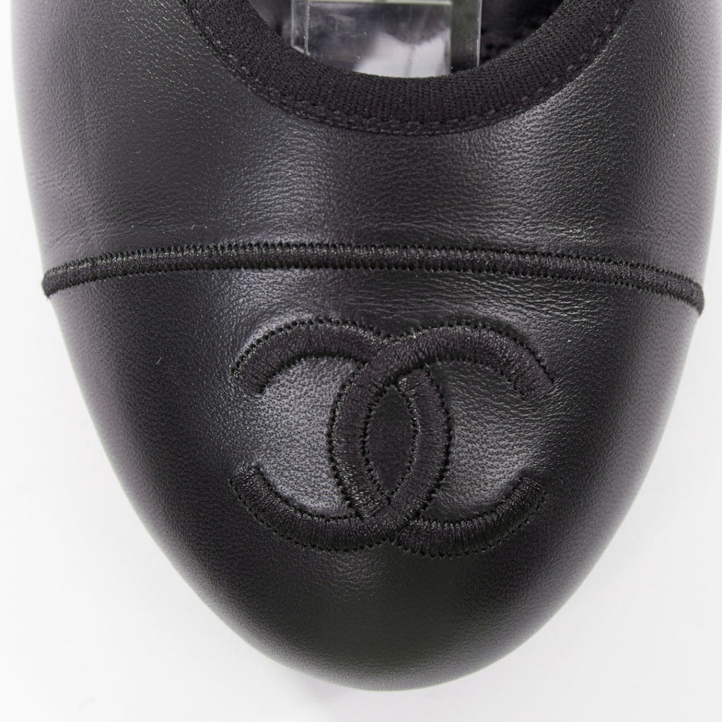 Women's Chanel black soft lambskin stitched CC cap toe flats