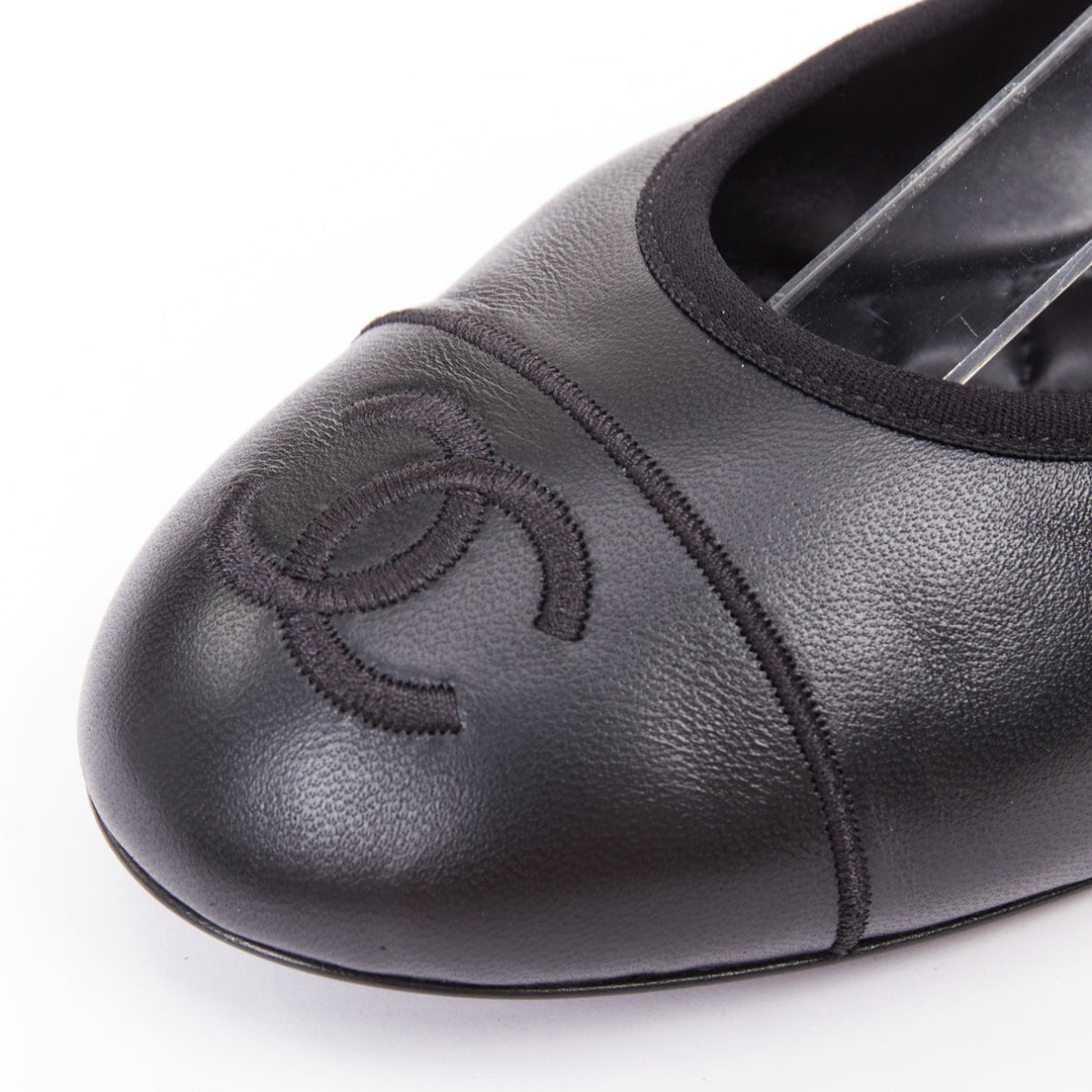 Women's Chanel black soft lambskin stitched CC cap toe flats