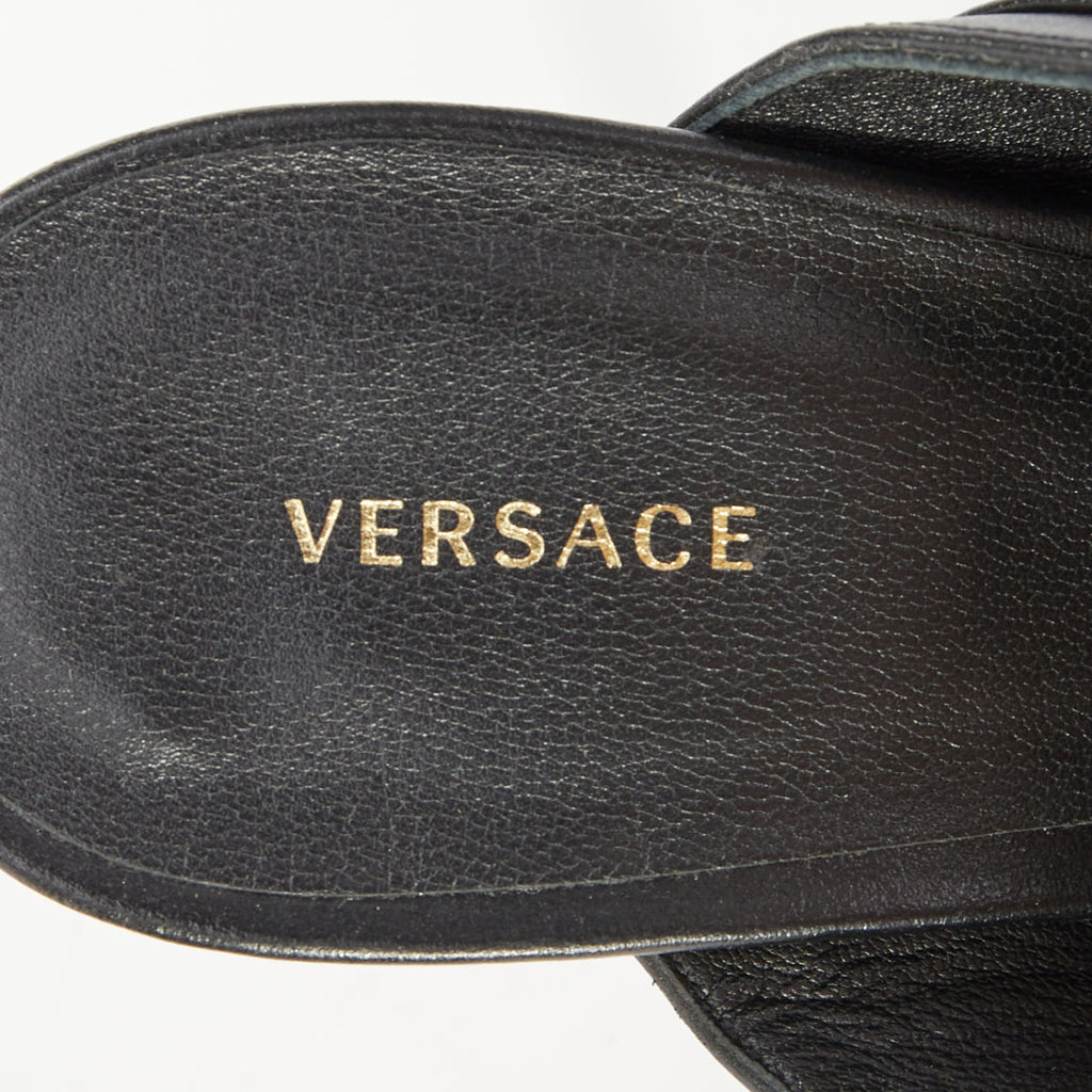 Women's Versace gold buckle black leather sandals