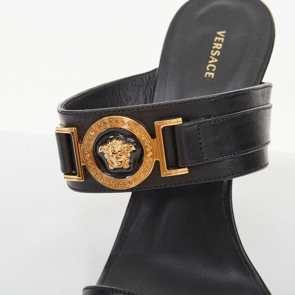 Women's Versace gold buckle black leather sandals