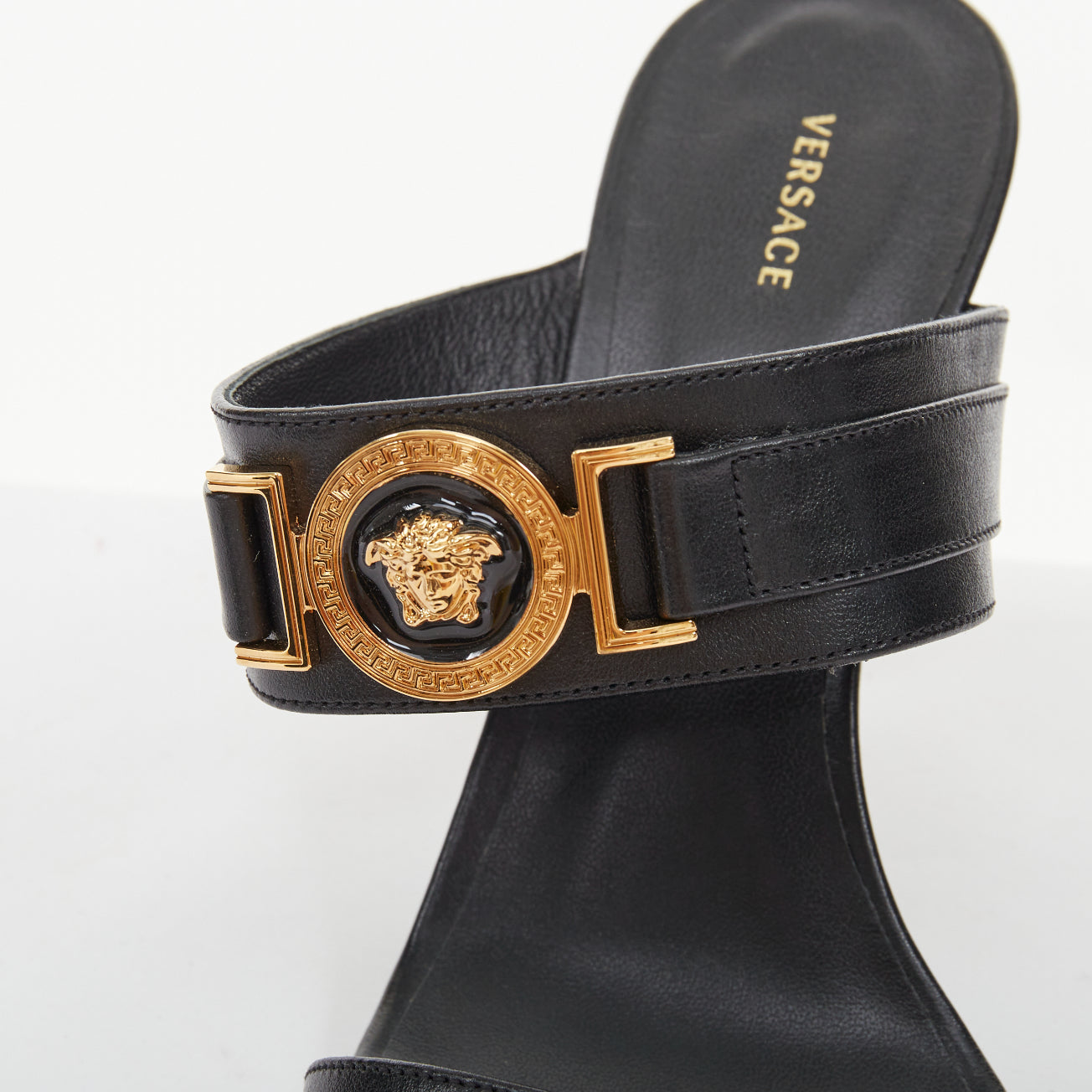 Women's Versace gold buckle black leather sandals
