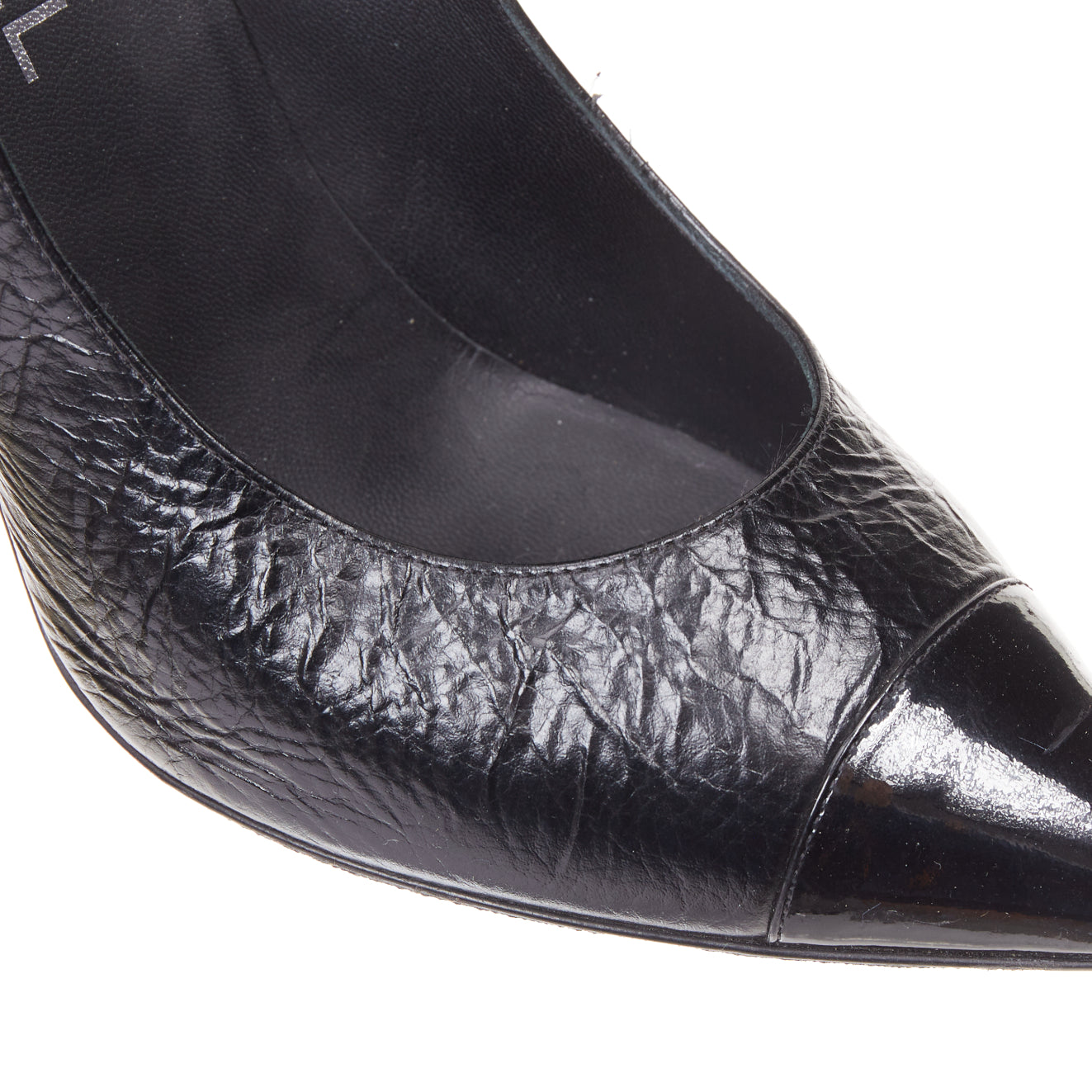 Women's Chanel Sculpted Sailor Knot black leather CC cap toe pumps