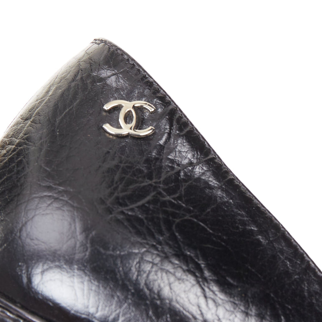 Women's Chanel Sculpted Sailor Knot black leather CC cap toe pumps