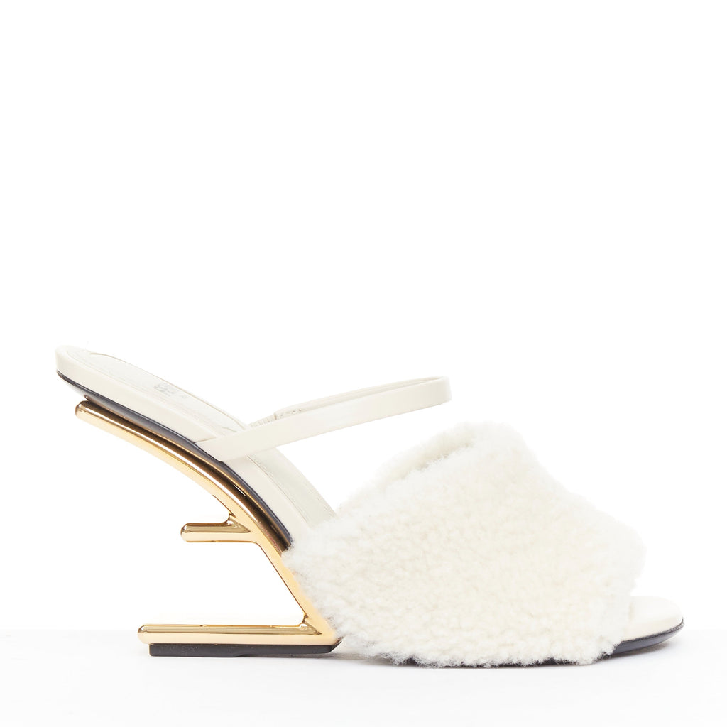 Women's Fendi First cream shearling gold F heel mule sandals