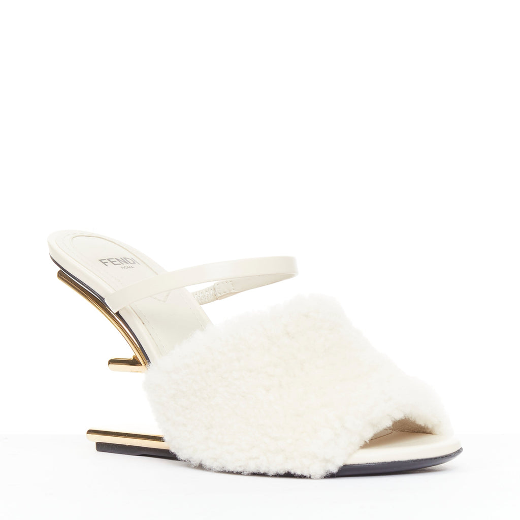 Women's Fendi First cream shearling gold F heel mule sandals