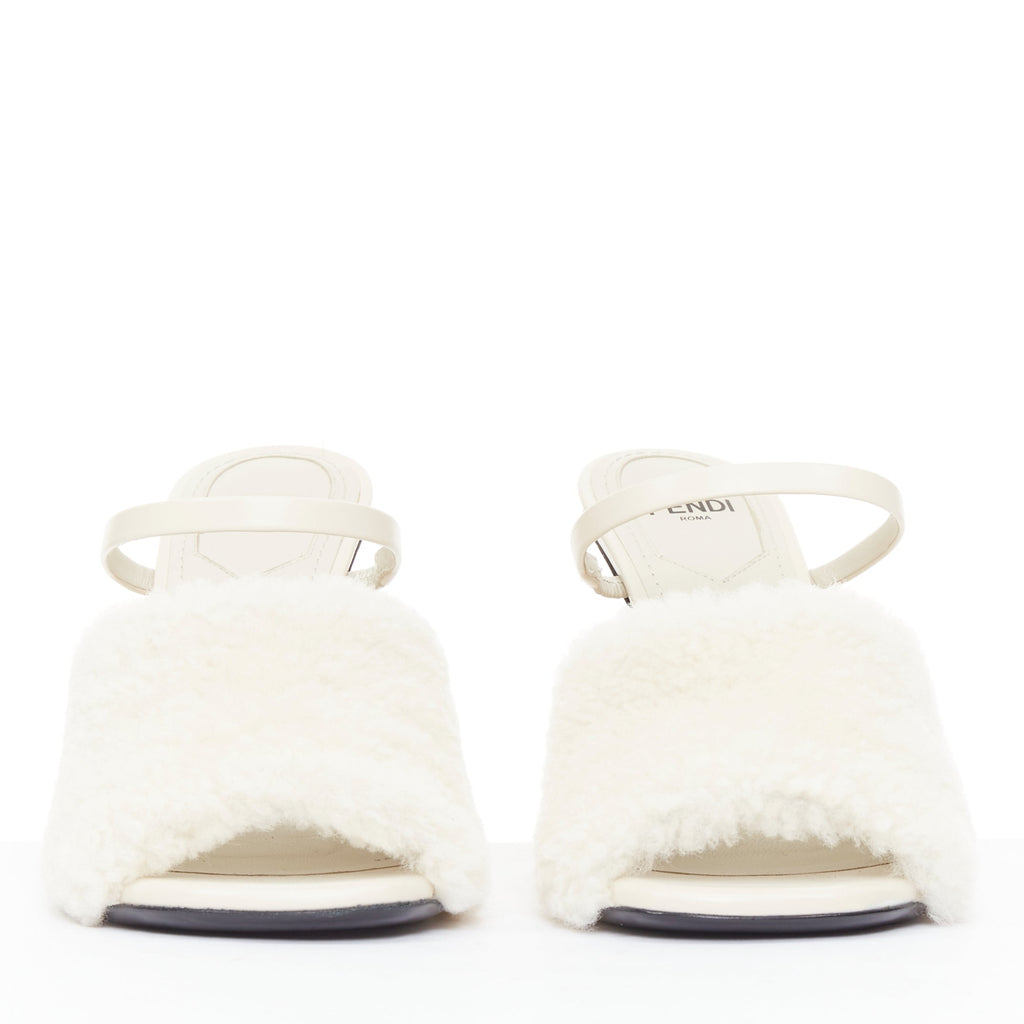 Women's Fendi First cream shearling gold F heel mule sandals