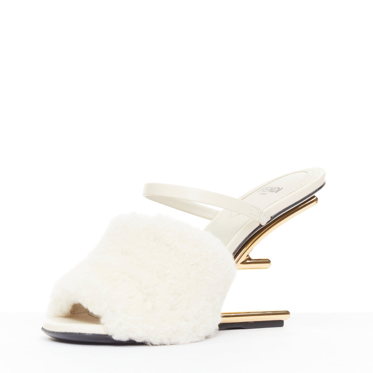 Women's Fendi First cream shearling gold F heel mule sandals