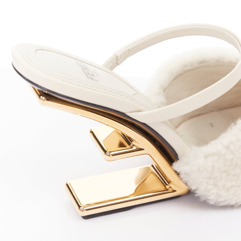 Women's Fendi First cream shearling gold F heel mule sandals