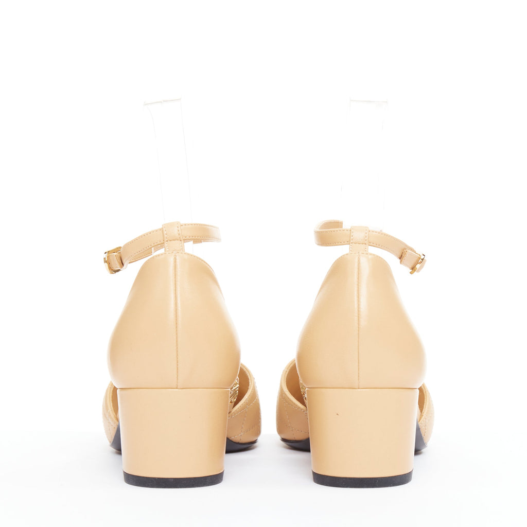 Women's Chanel nude quilted lambskin CC grosgrain cap toe pumps