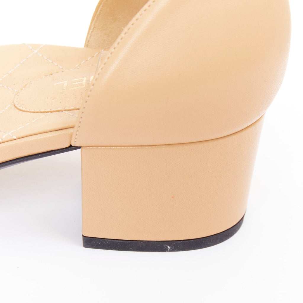 Women's Chanel nude quilted lambskin CC grosgrain cap toe pumps