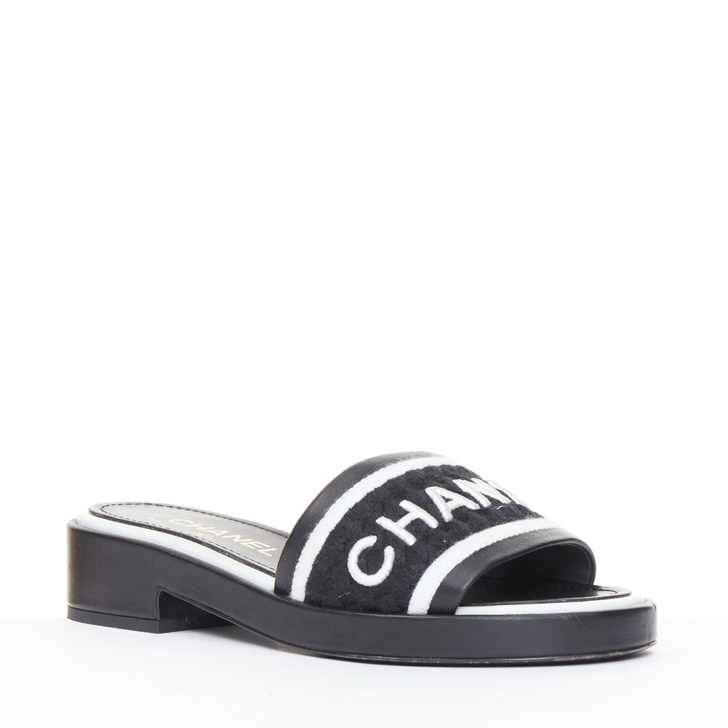 Women's Chanel black white logo embroidered lambskin heeled mules