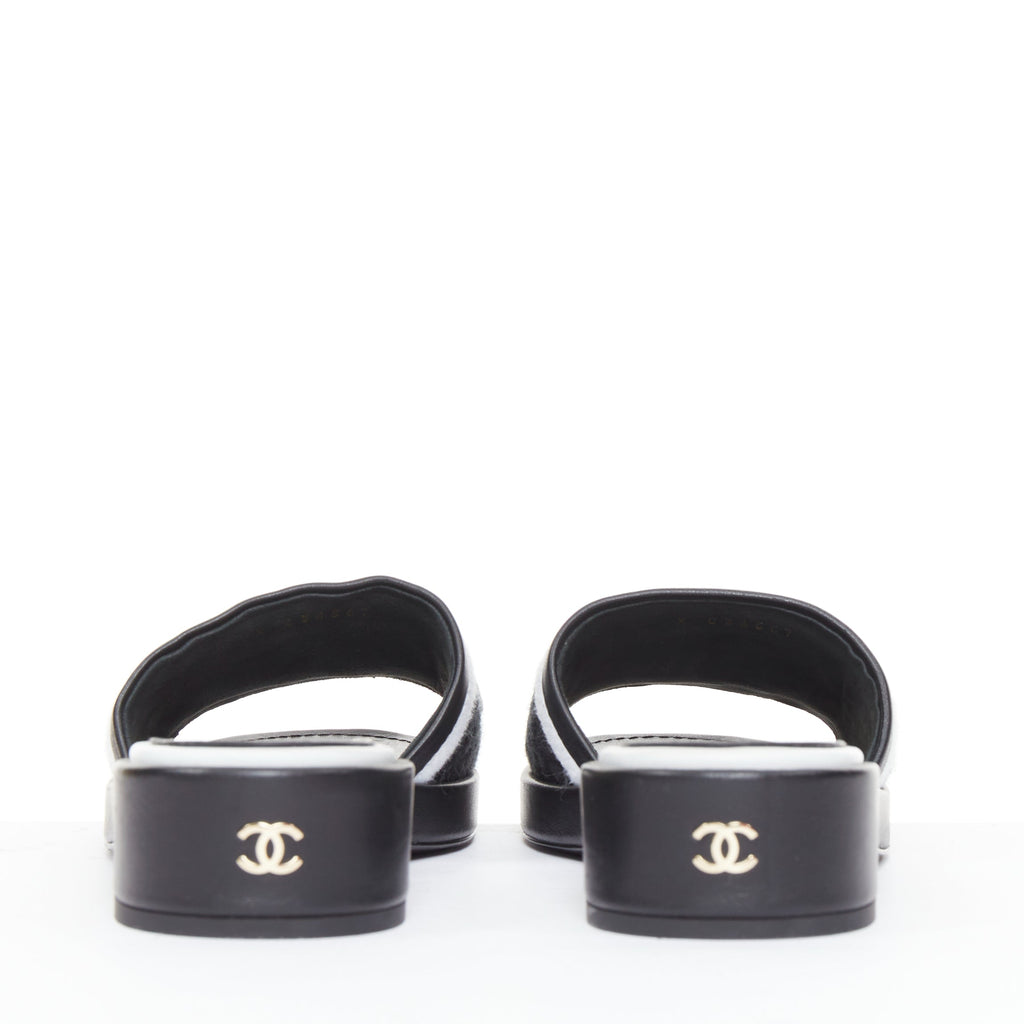Women's Chanel black white logo embroidered lambskin heeled mules