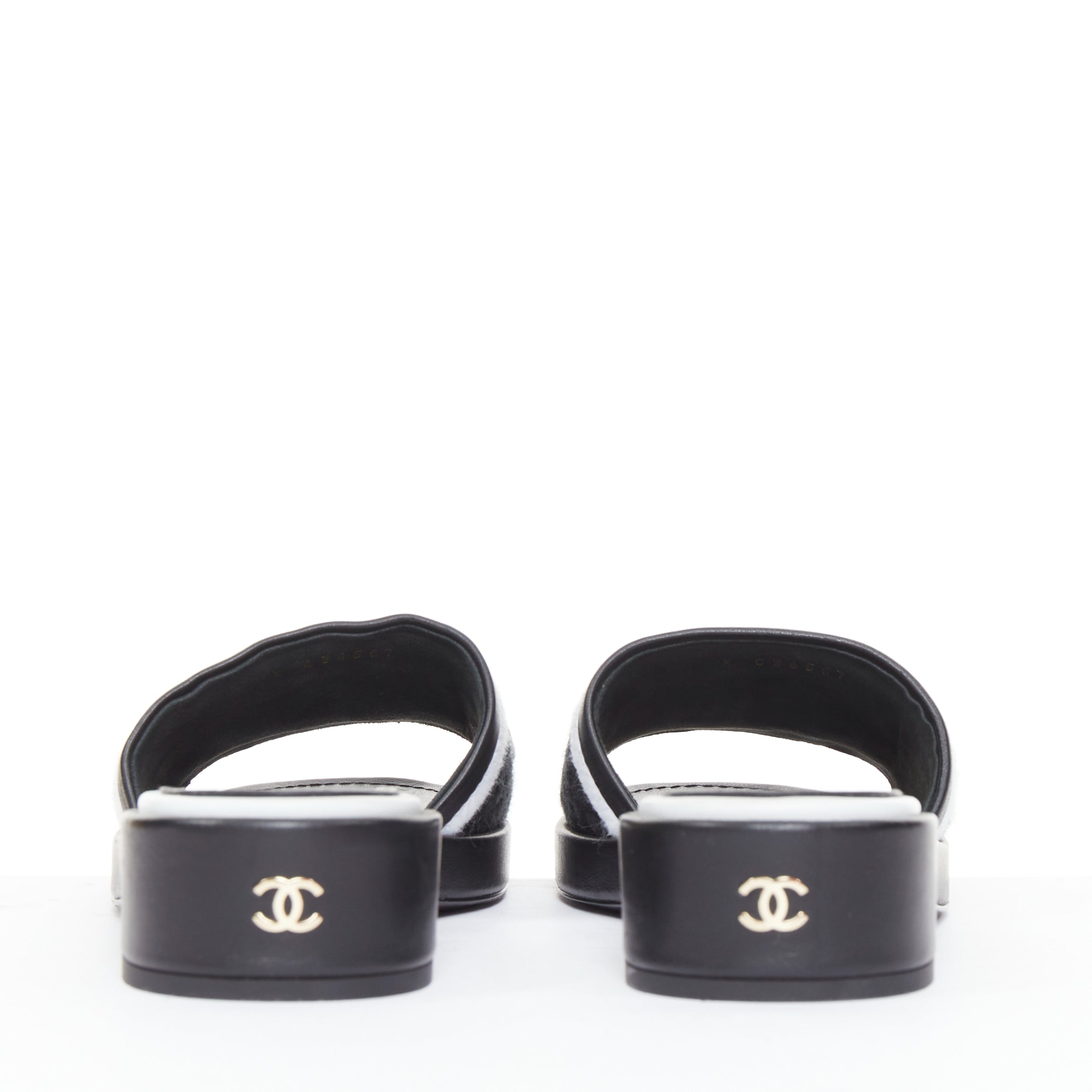 Women's Chanel black white logo embroidered lambskin heeled mules