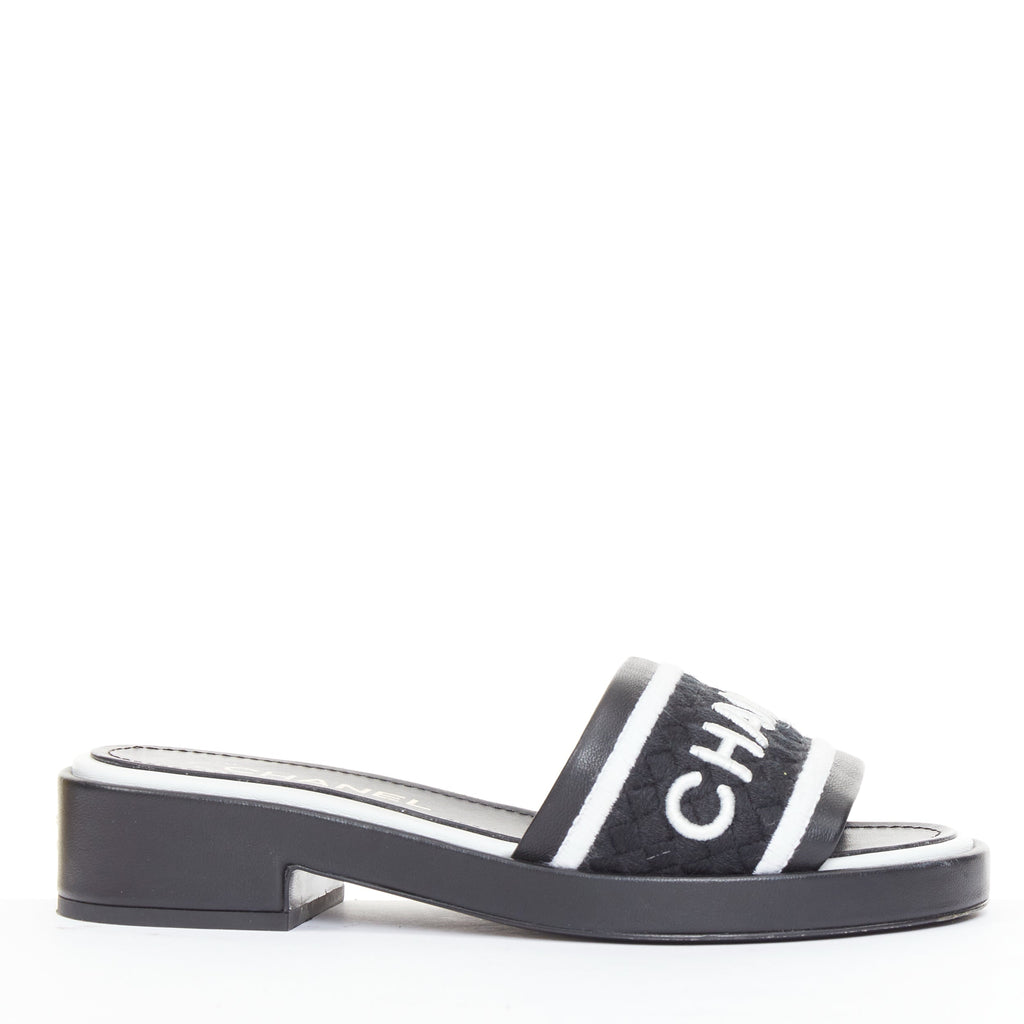 Women's Chanel black white logo embroidered lambskin heeled mules