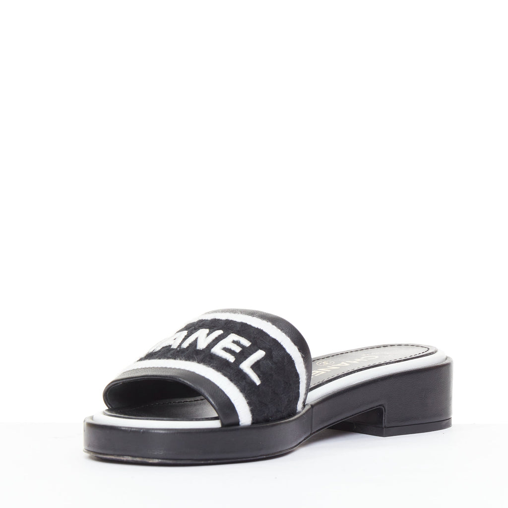 Women's Chanel black white logo embroidered lambskin heeled mules
