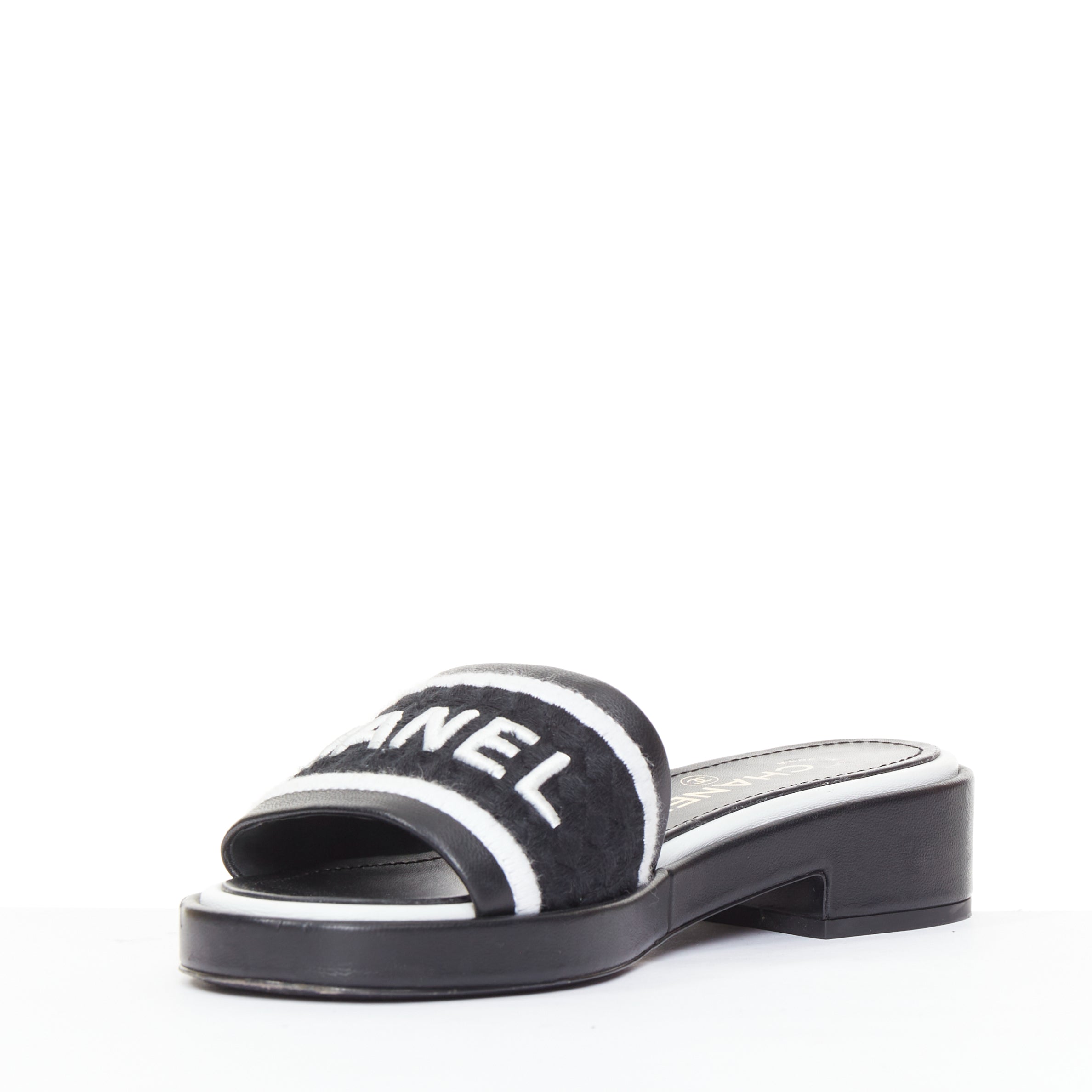 Women's Chanel black white logo embroidered lambskin heeled mules