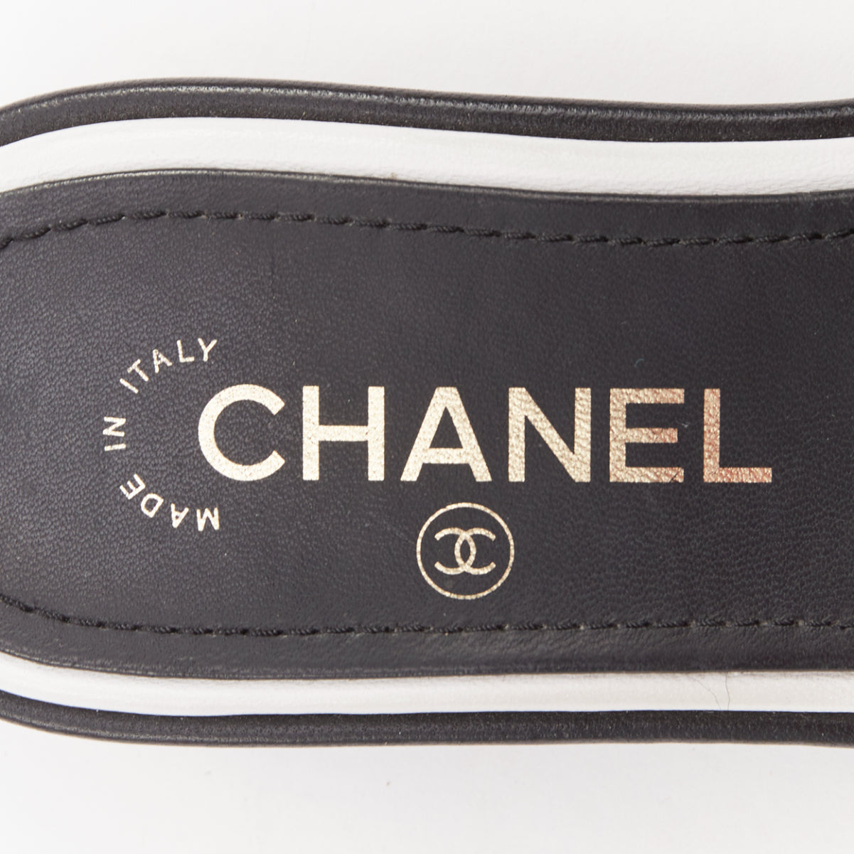 Women's Chanel black white logo embroidered lambskin heeled mules