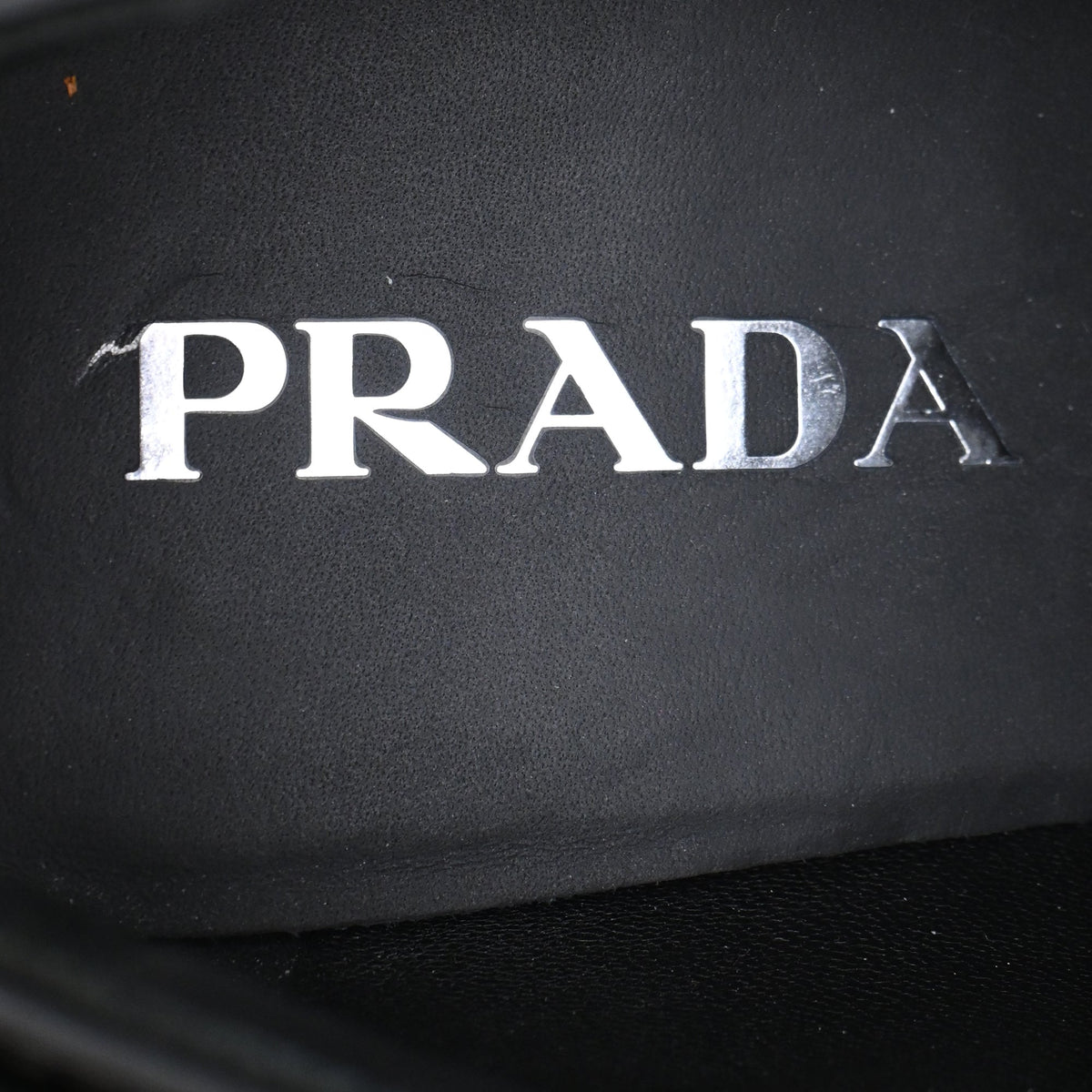Women's Prada Triangle Logo Loafers in Black Patent Leather