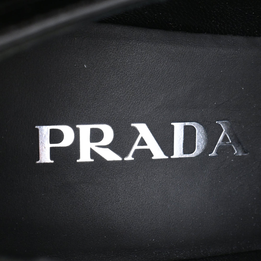 Women's Prada Triangle Logo Loafers in Black Patent Leather